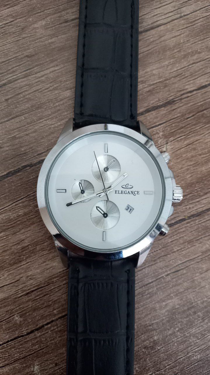 ساعت الگانس تقویم دار صفحه سفید بند چرم مشکی مدل ریتا